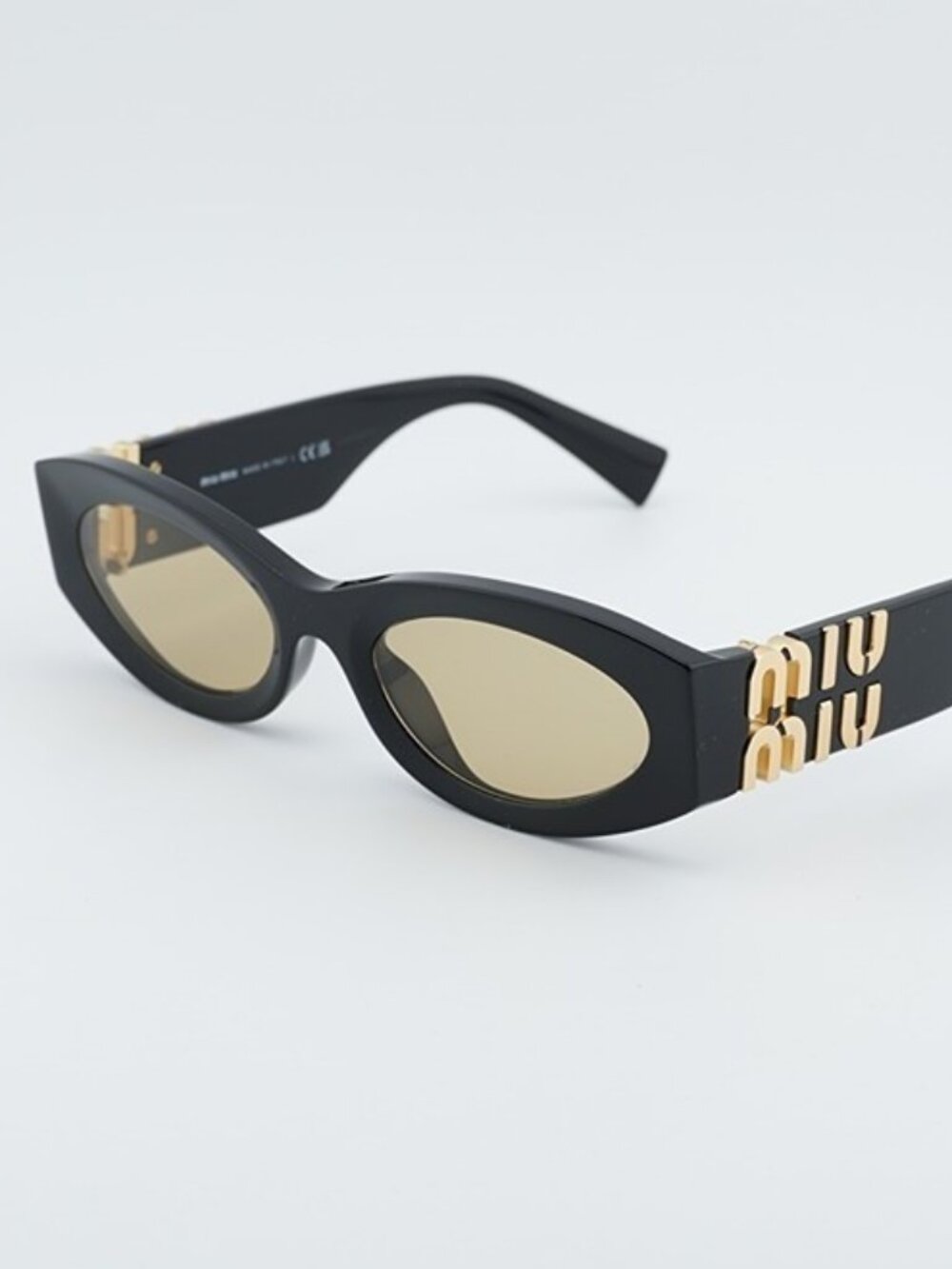 Miu Miu MU11WS 16K10R Women Sunglasses Black Oval Frame, Yellow Lenses